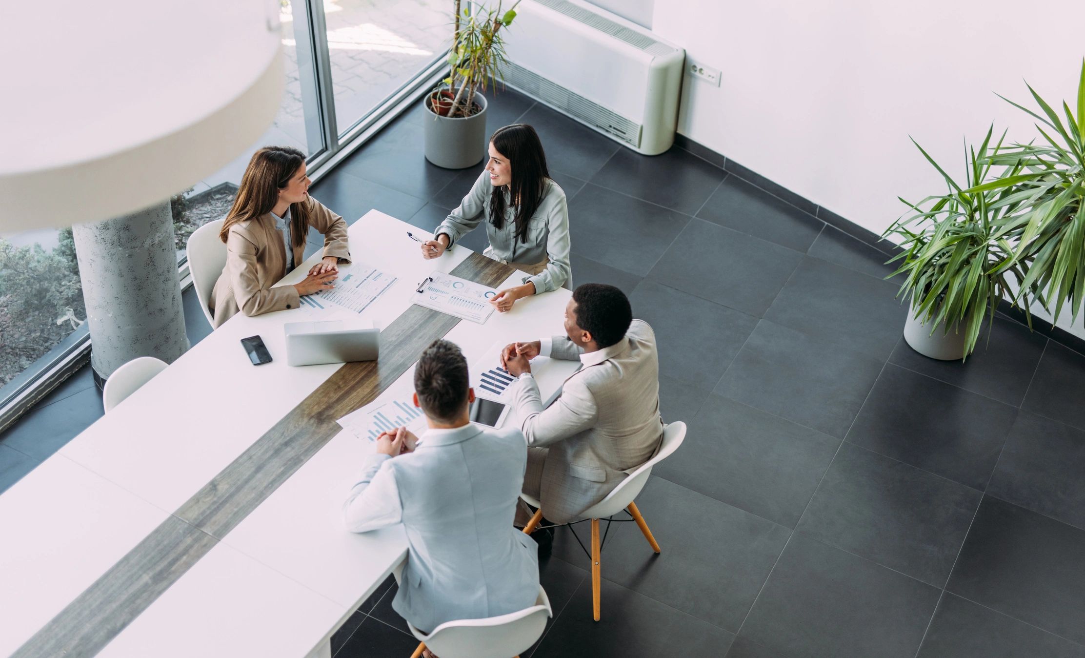 Consulting team in a boardroom meeting reviewing strategy